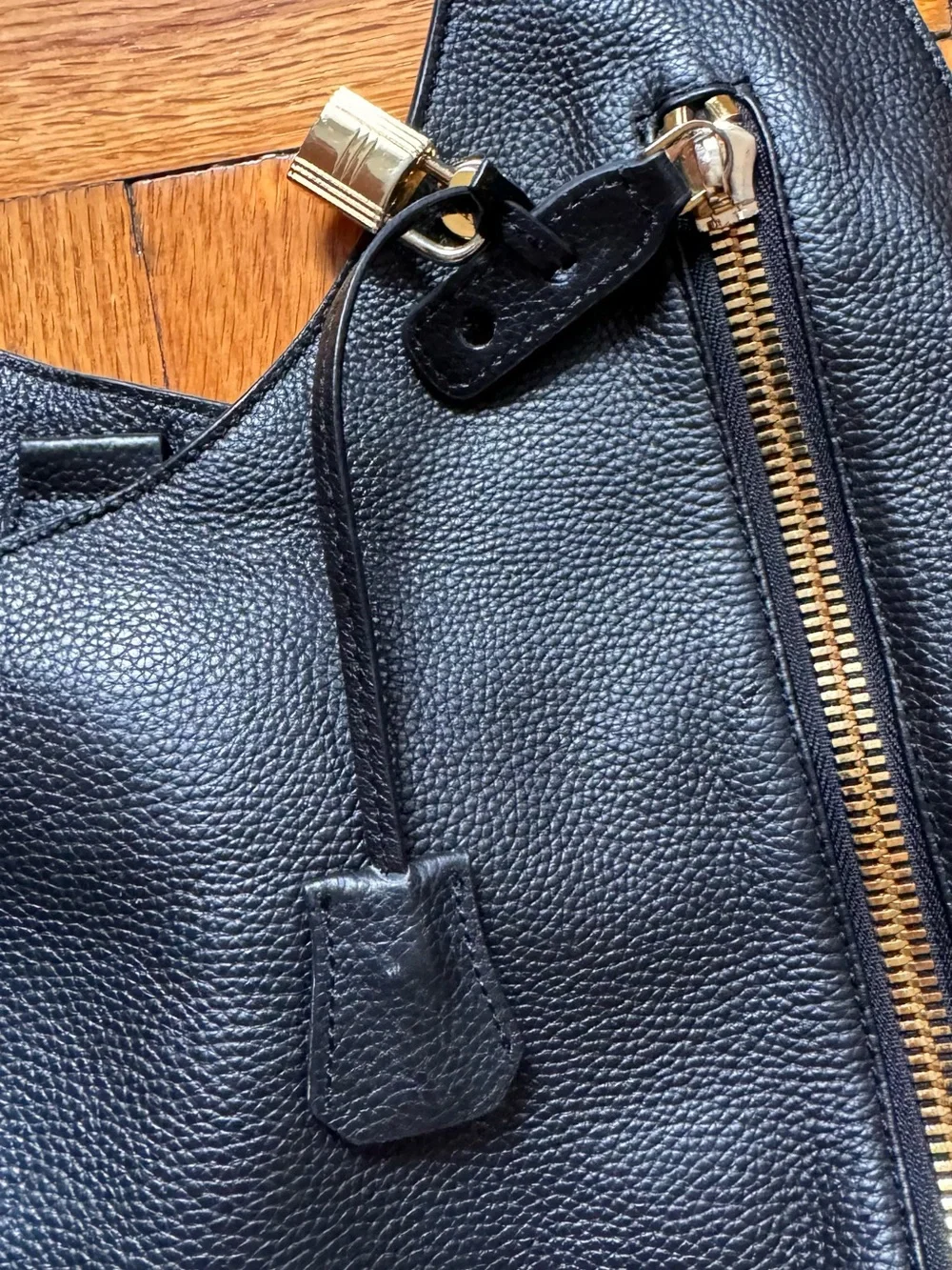 Black Pebbled Leather Shoulder Bag with Gold Zip Accent